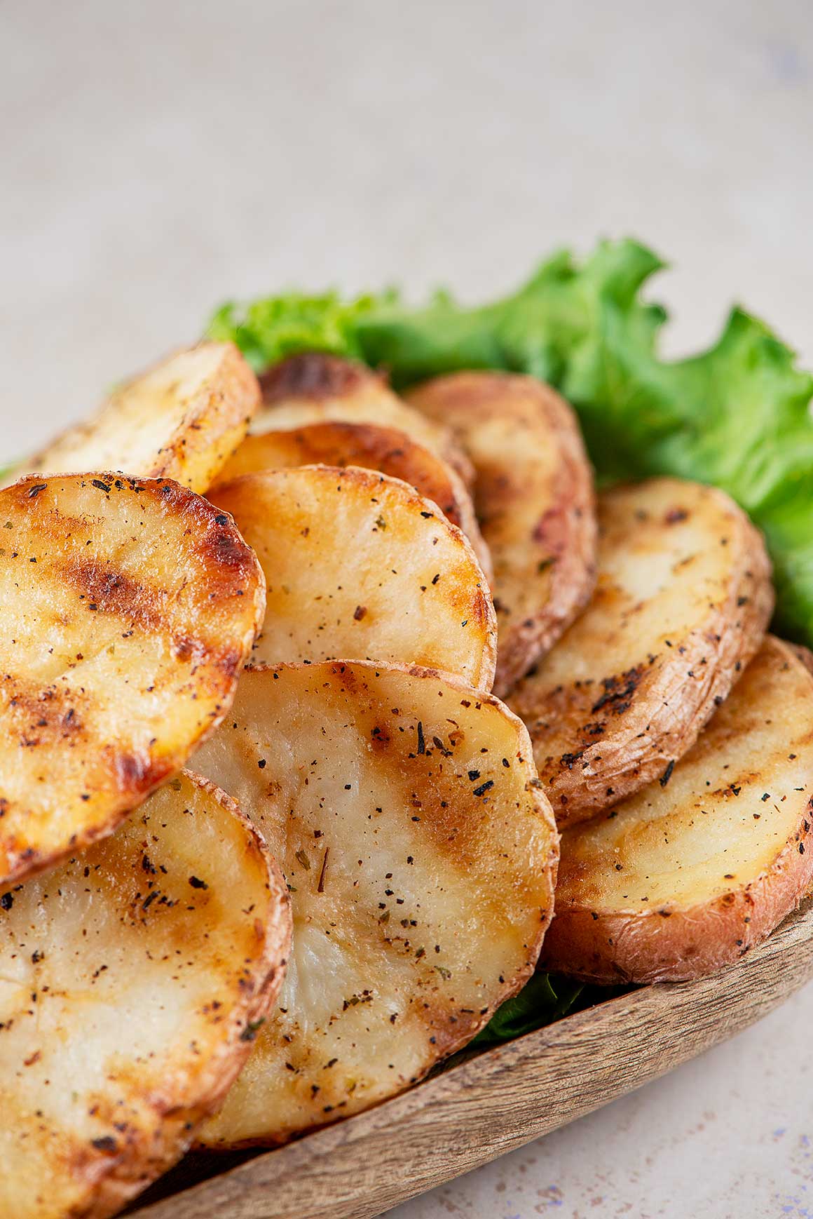 close up photo of grilled potatoes.
