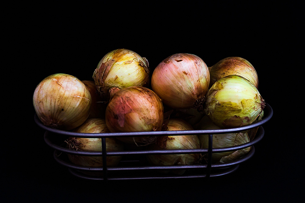 metal basket filled with onions